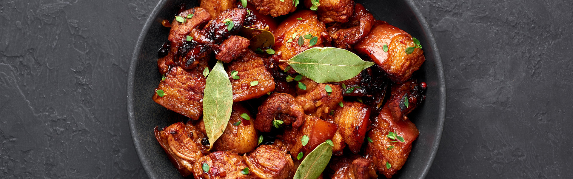 Adobo Pork in black bowl